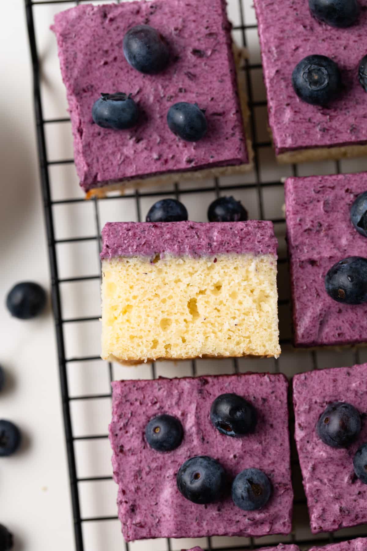 Blueberry mousse cake on wire rack.