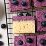 Blueberry mousse cake on wire rack.