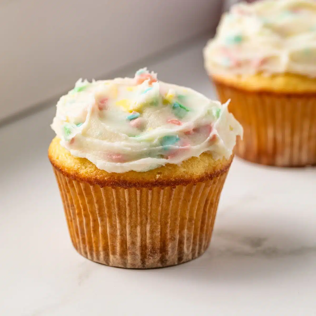 Rainbow chip frosting on cupcakes.