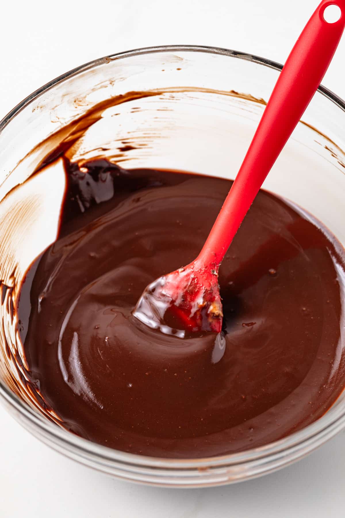 Melted chocolate in glass bowl.