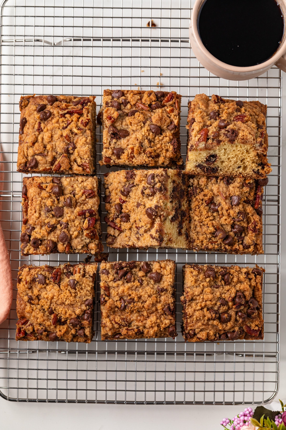 Overhead view of chocolate chip coffee cake cut into squares.