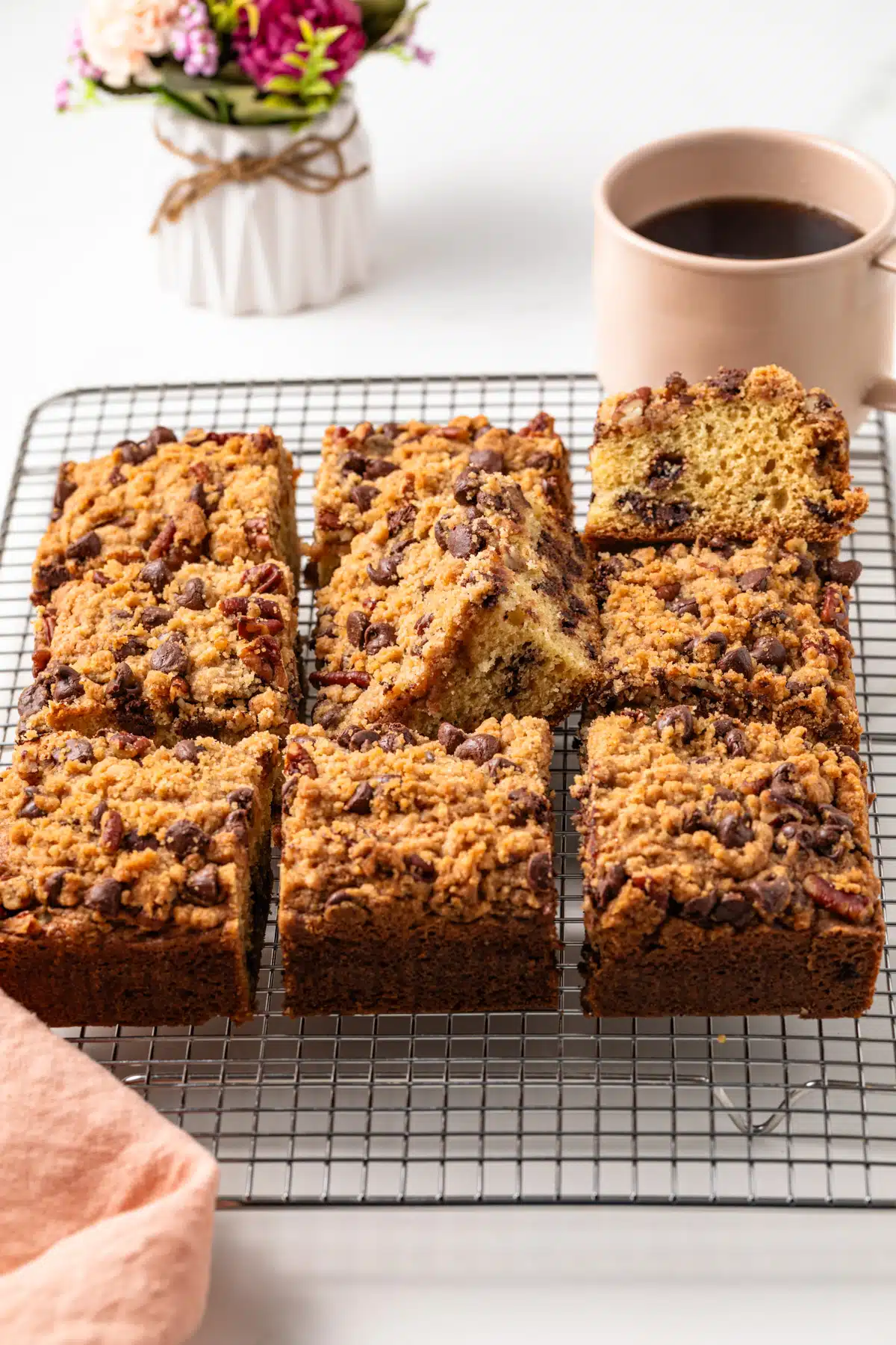 Side view of chocolate chip coffee cake cut into squares.