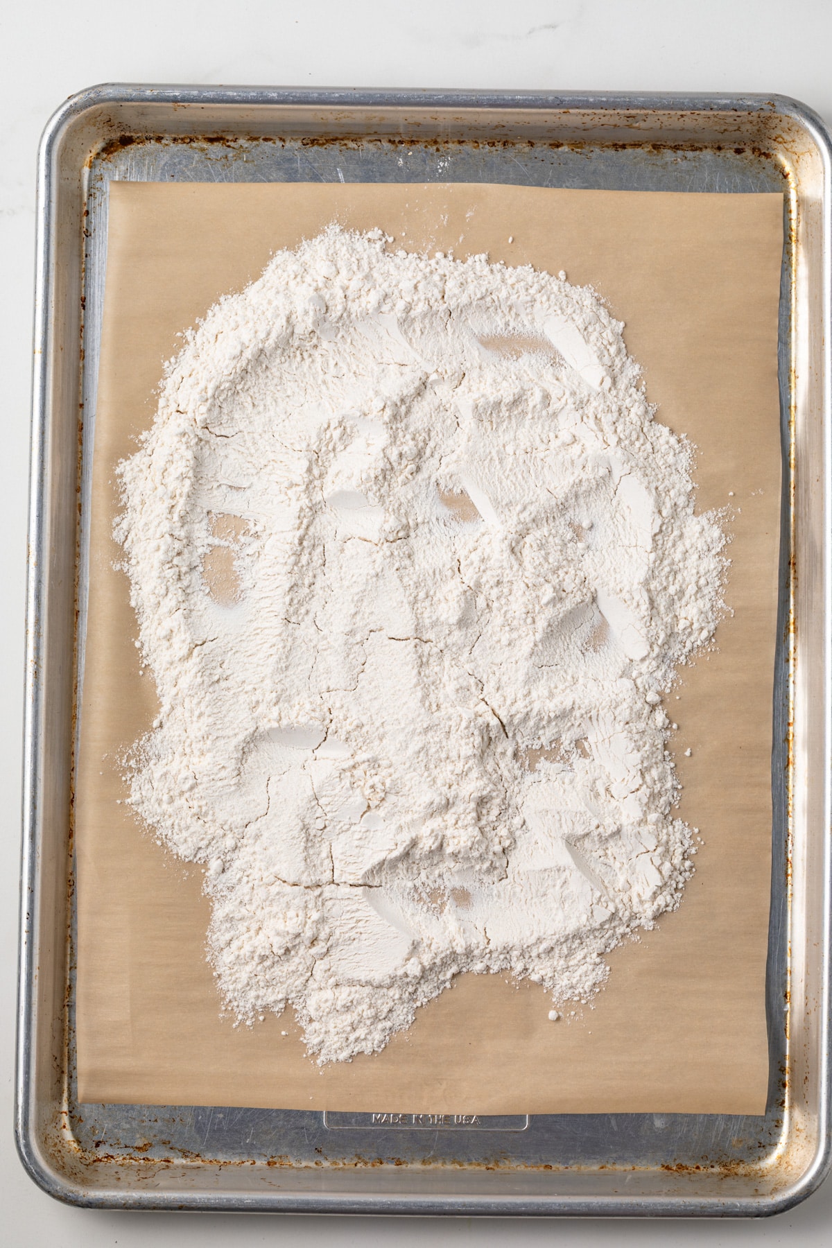 Heat treated flour on baking sheet.
