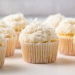 Coconut Cupcakes on a table top.
