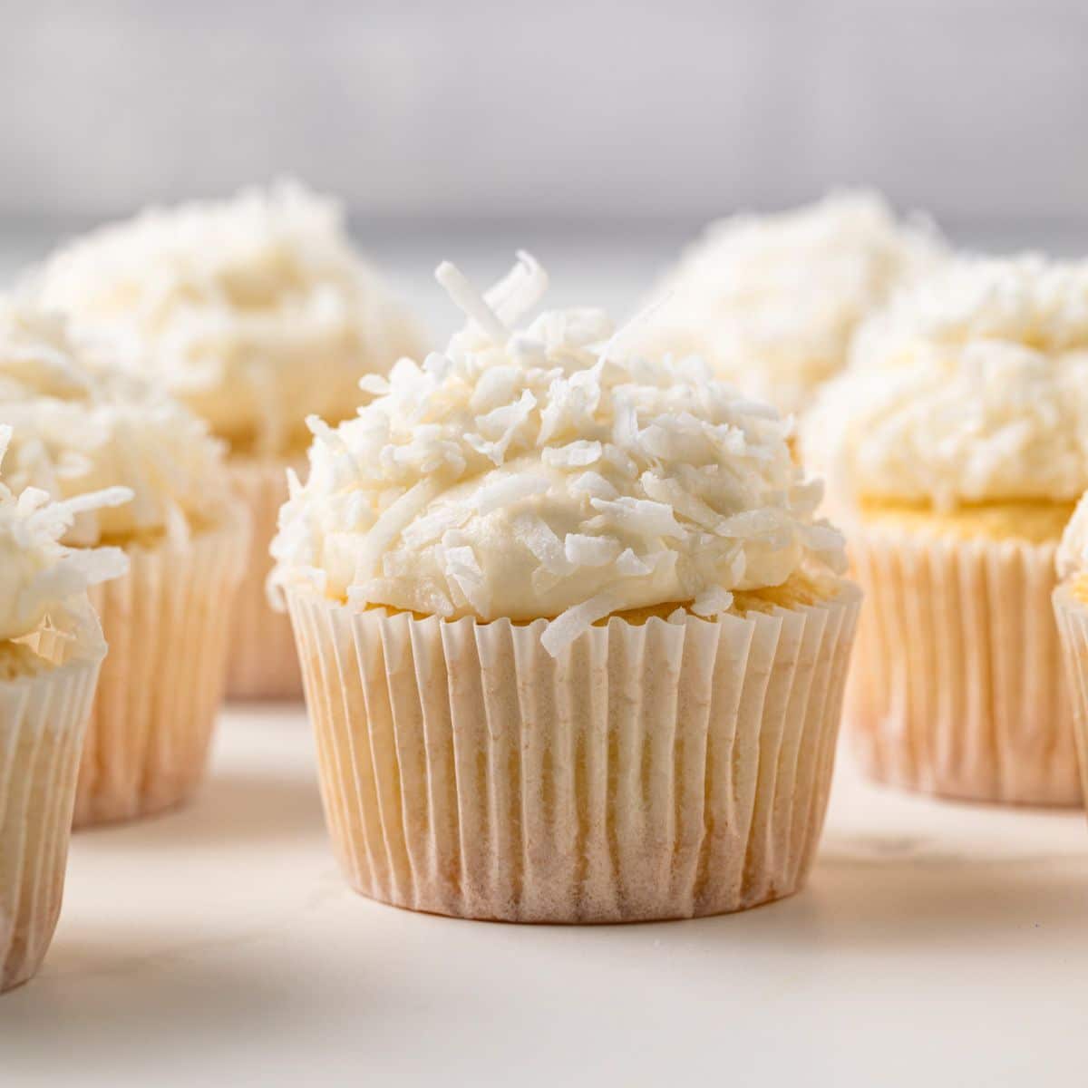 Coconut Cupcakes on a table top.