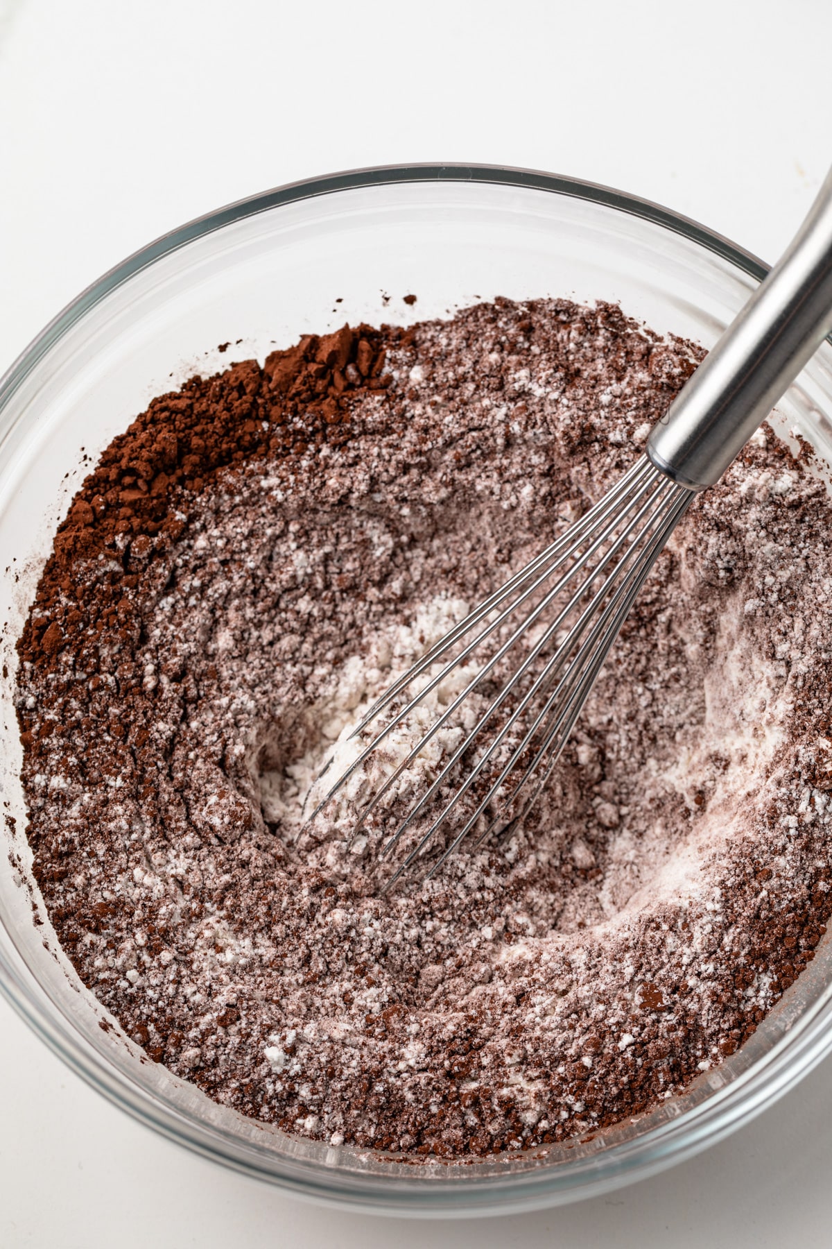 Dry ingredients mixed in a glass bowl.