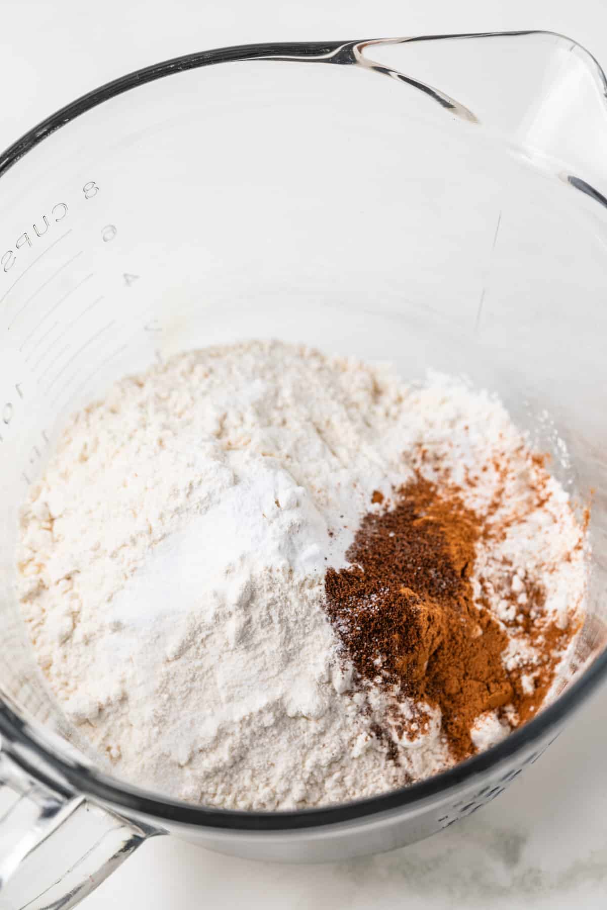 Dry ingredients mixed in glass bowl.