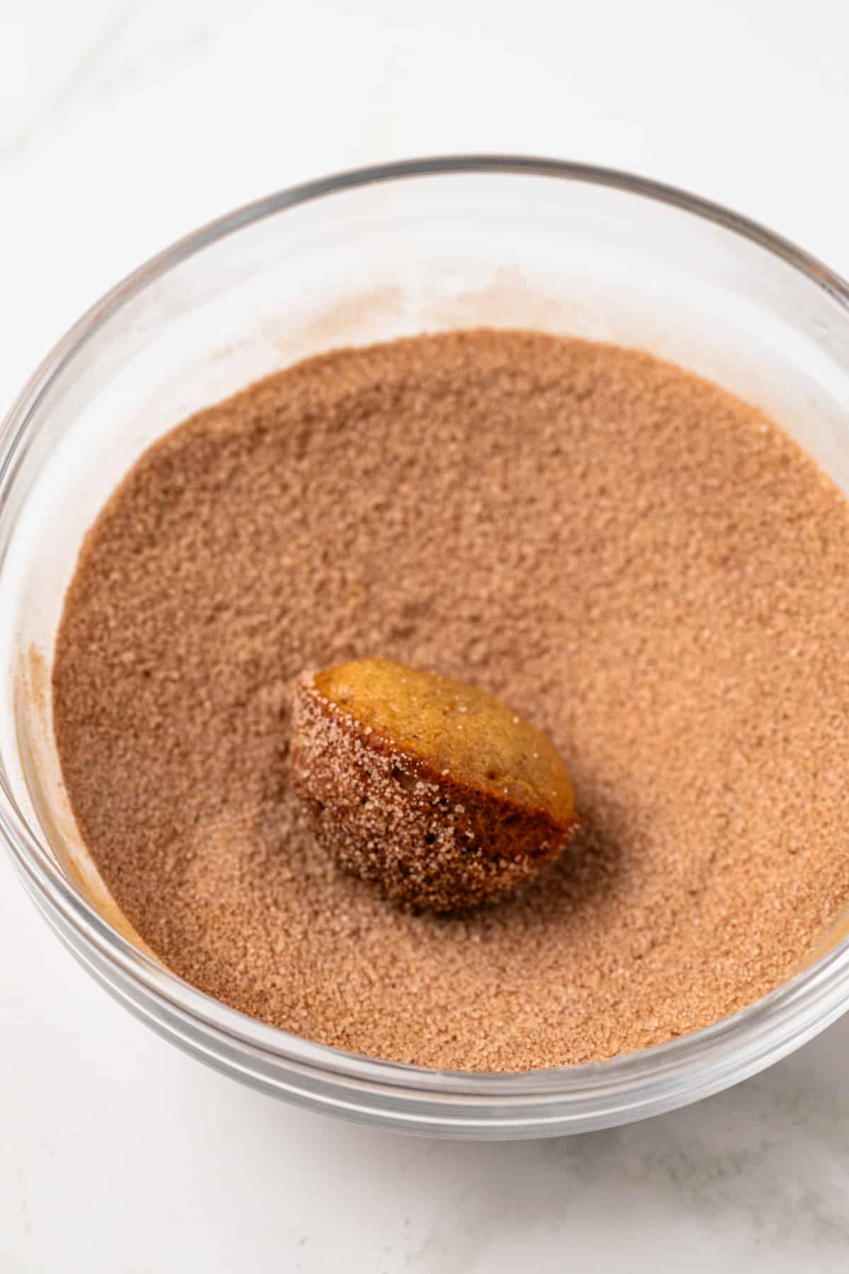 Donut hole rolled in cinnamon sugar.