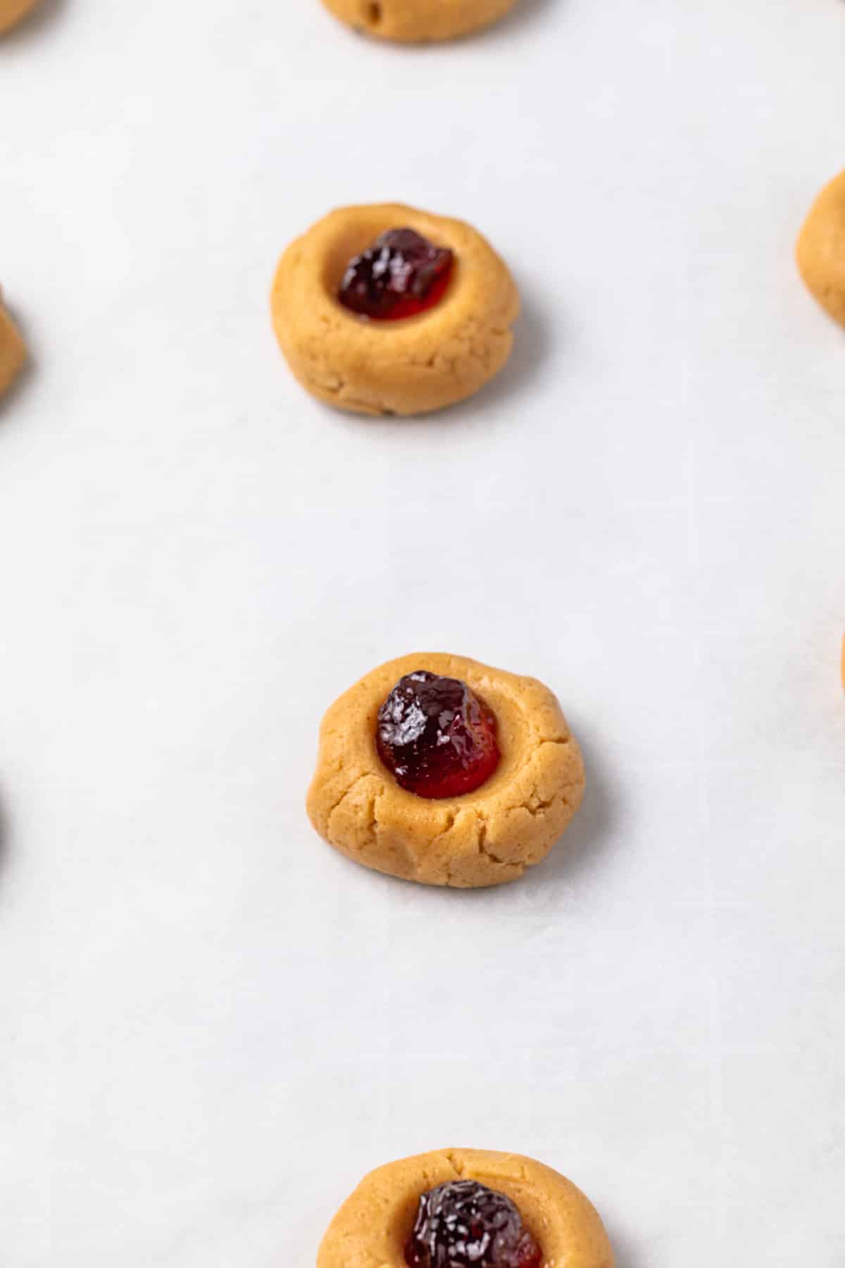 Unbaked cookies on a baking sheet.