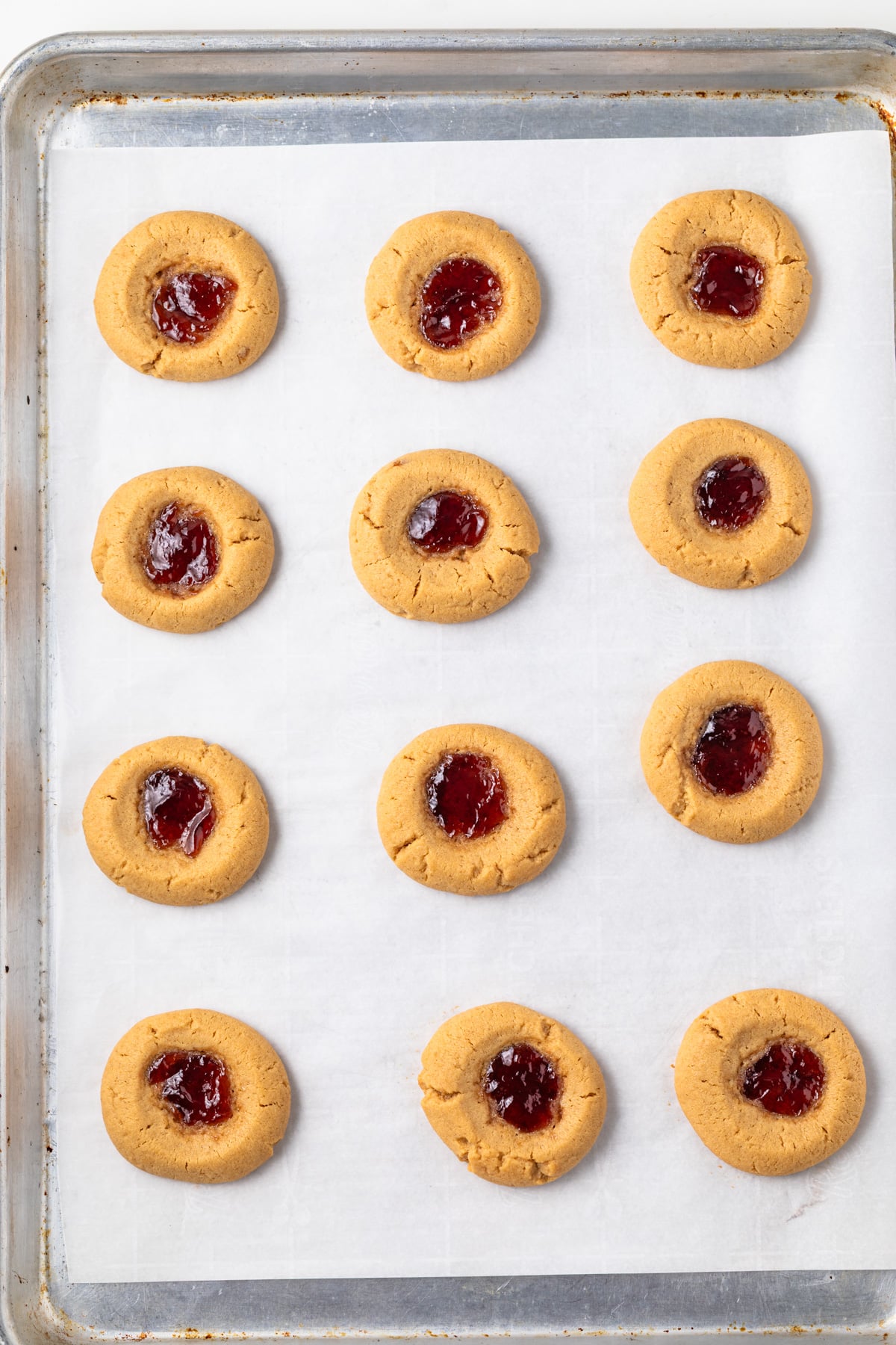 Baked peanut butter thumbprint cookies with jelly.