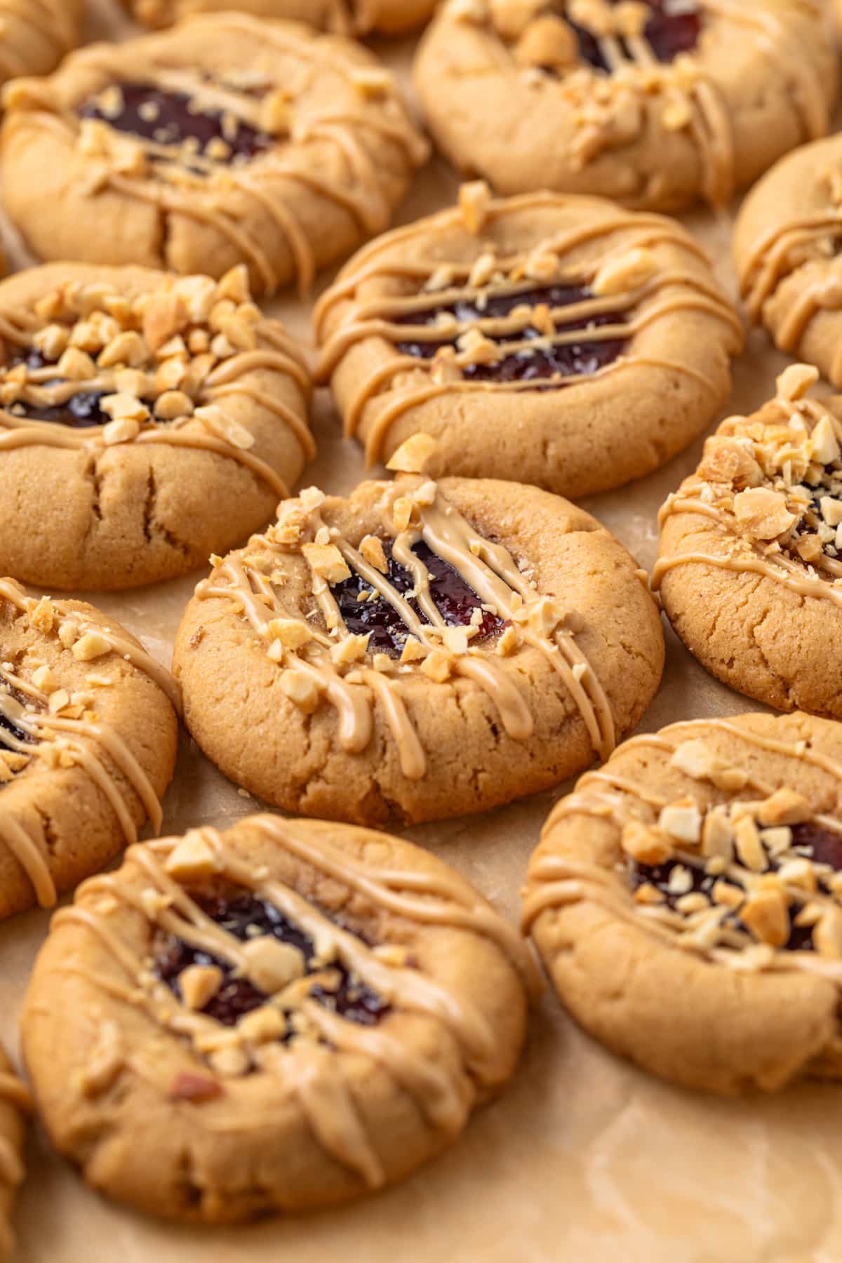 Angled view of peanut butter and jelly cookies.