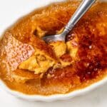 Spoon scooping out pumpkin creme brulee.