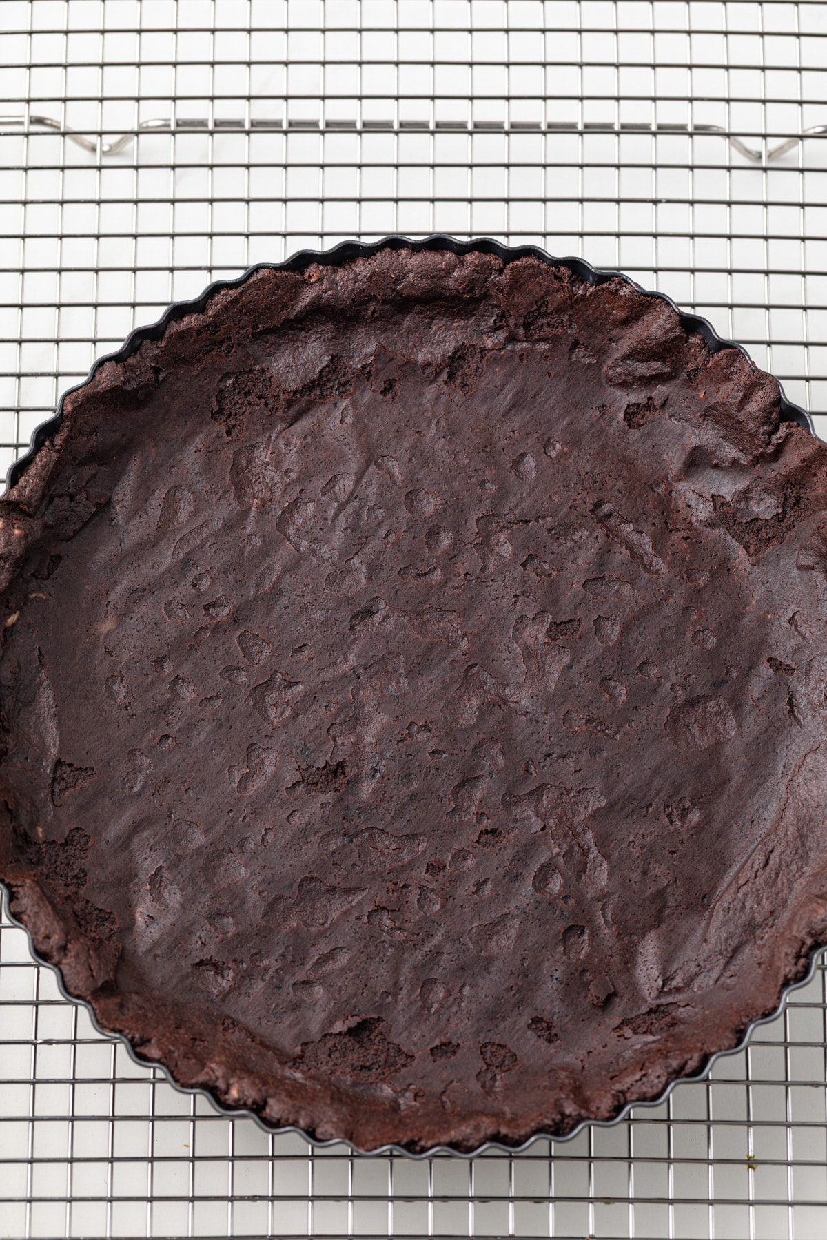 Baked chocolate crust in tart pan.