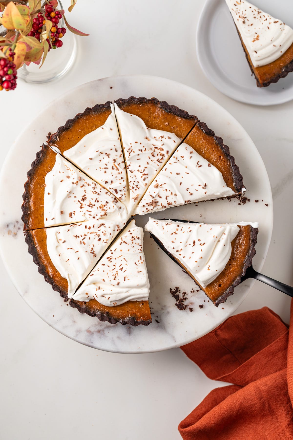 Overhead of sliced chocolate pumpkin tart.