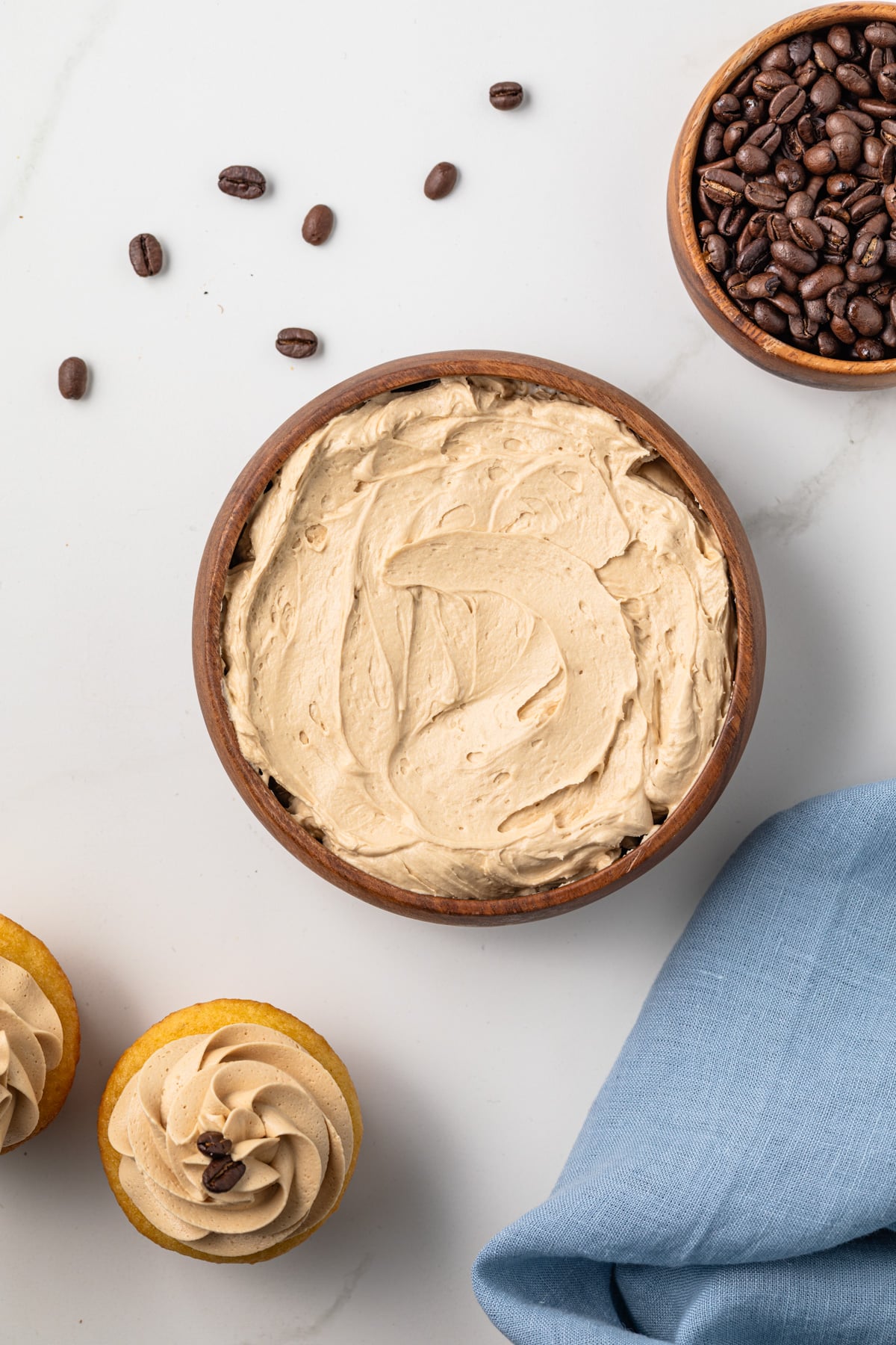 Coffee frosting in a wooden bowl.
