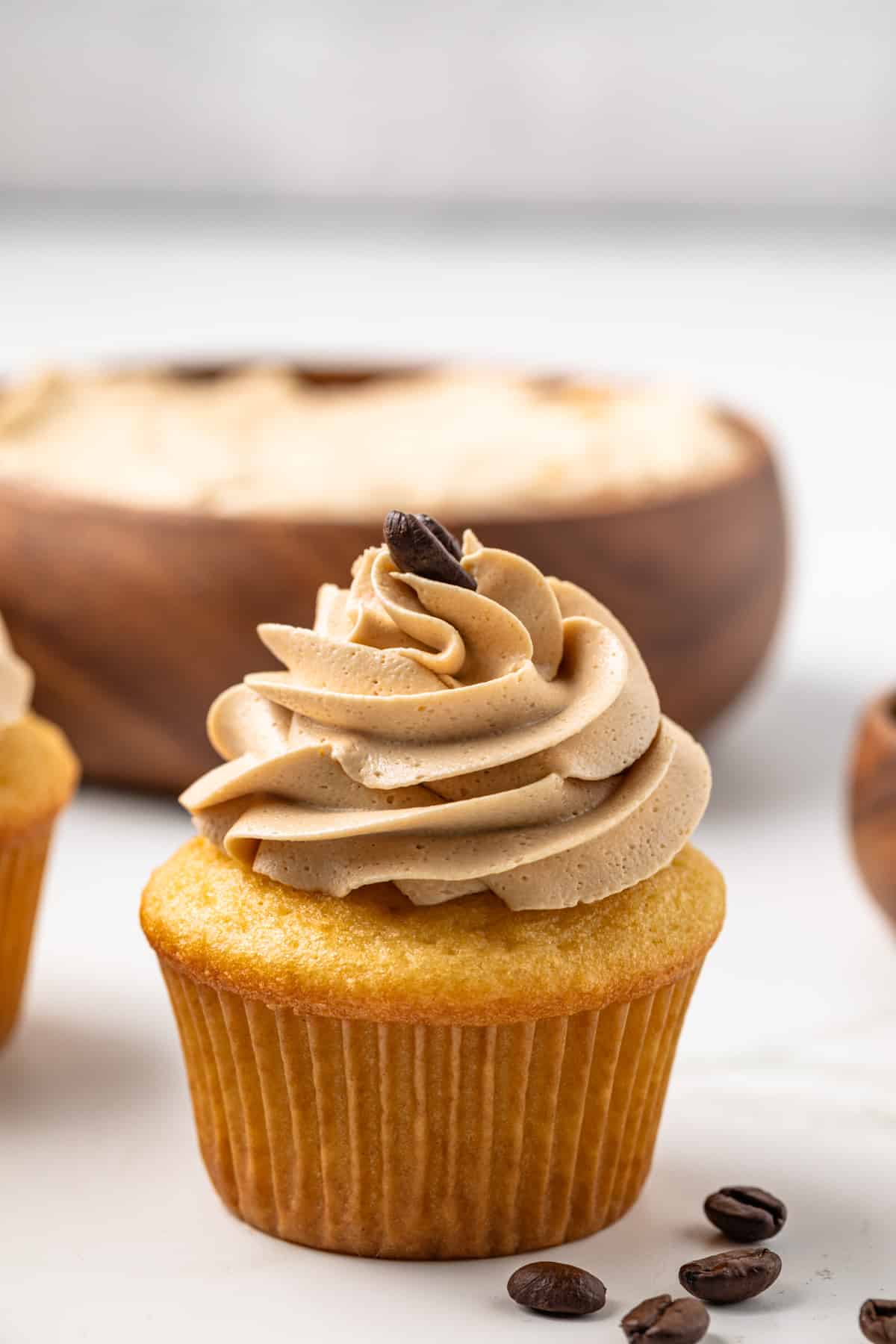 Vanilla cupcakes frosted with coffee frosting.