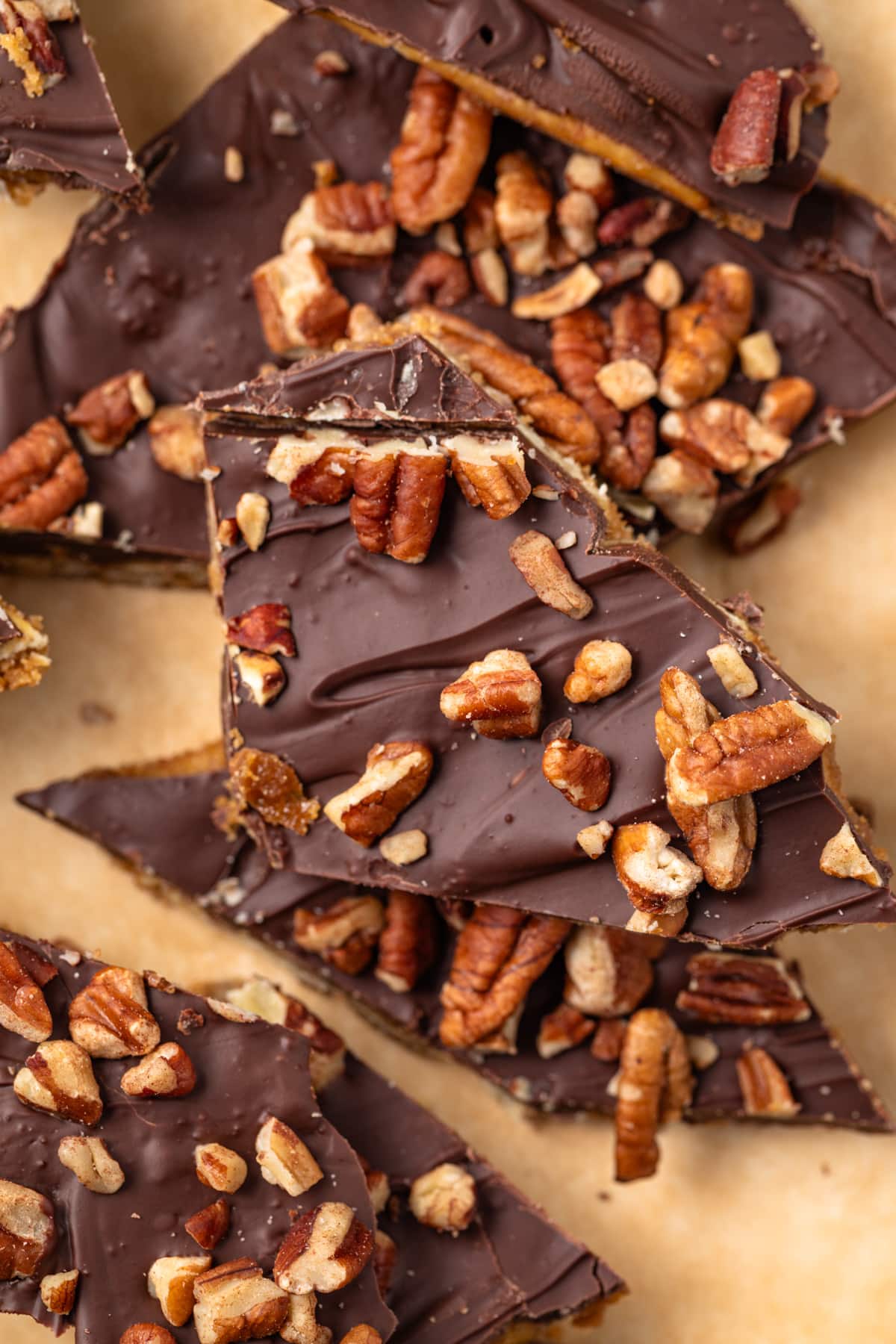 Close up of saltine cracker toffee on parchment paper.