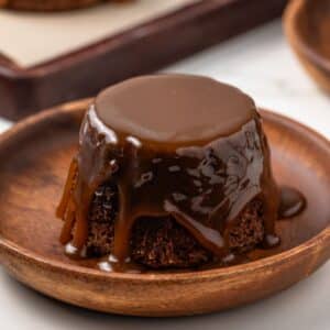 Sticky toffee pudding with a slice taken out by a fork.
