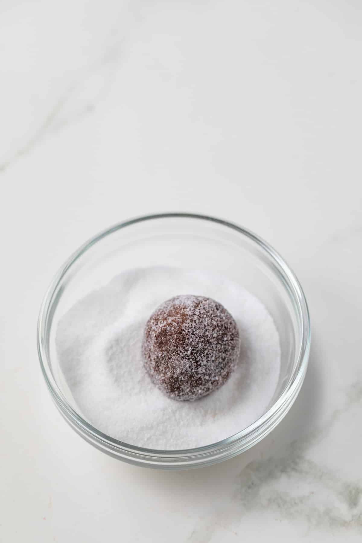 Chocolate cookie dough ball rolled in sugar.