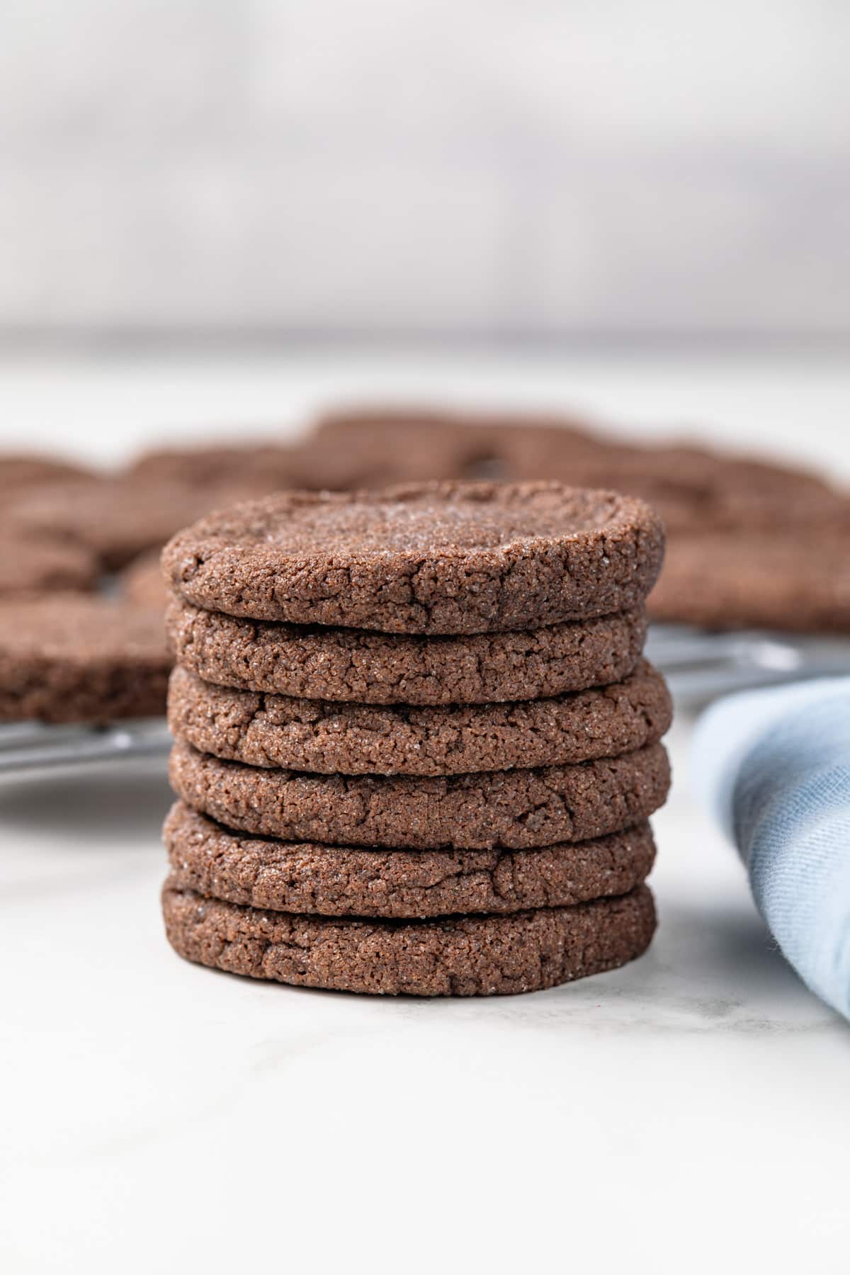 Six chocolate sugar cookies stacked.