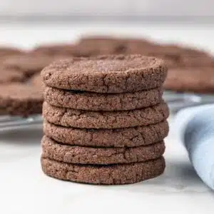 Six chocolate sugar cookies stacked.