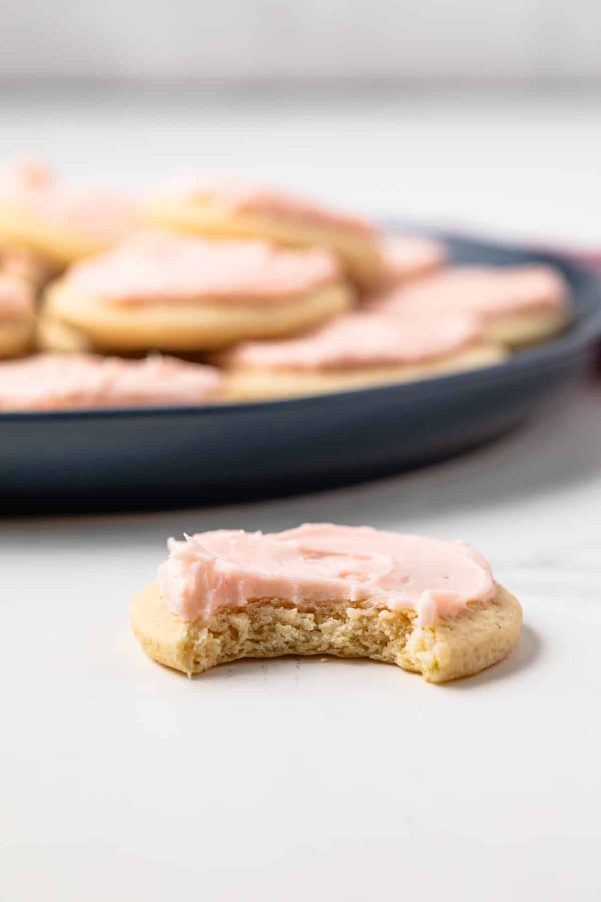 Loft house cookie with a bite taken out.