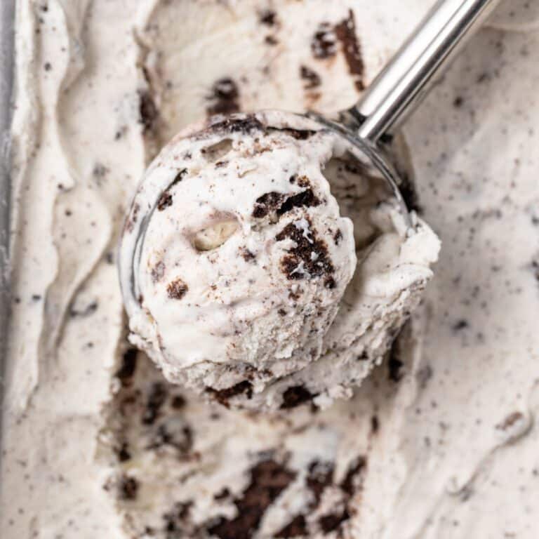 A scoop scooping out oreo ice cream.