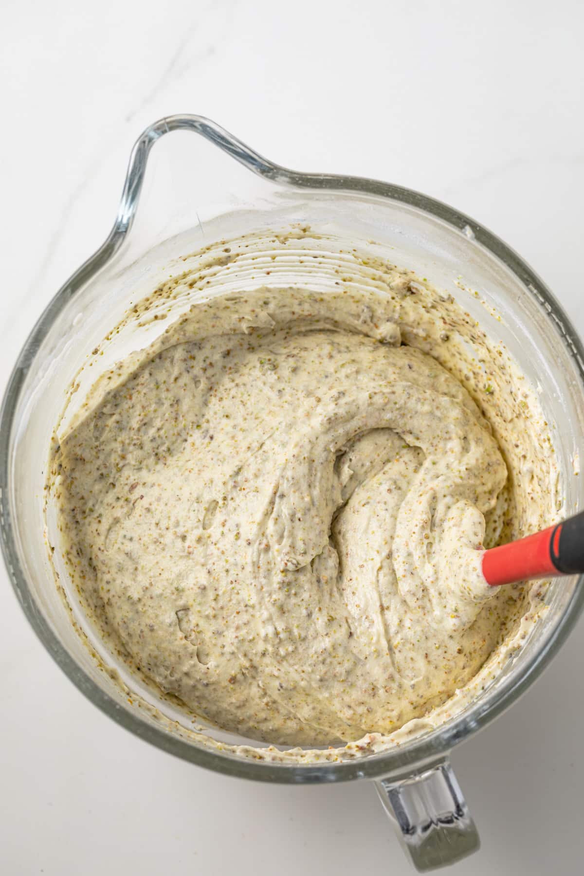 Cake batter in a glass bowl.