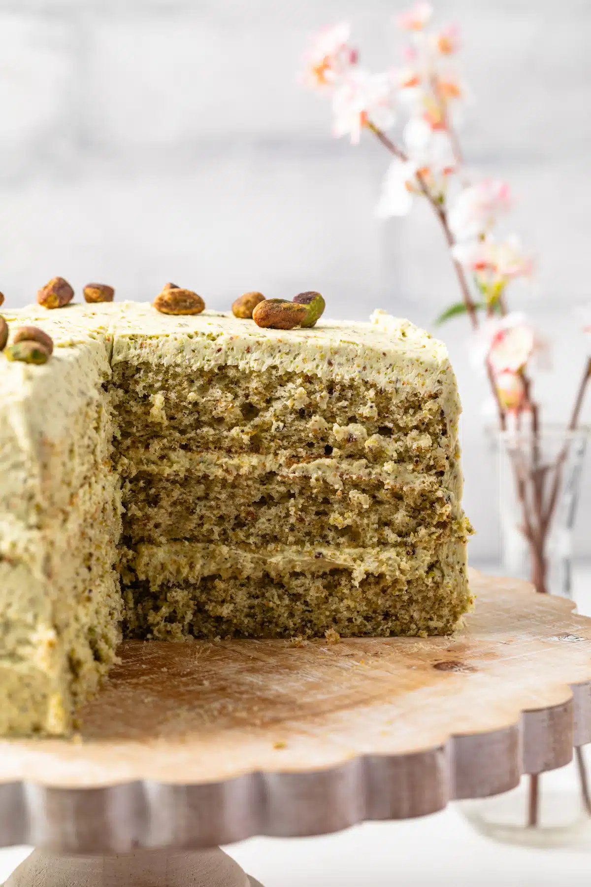 Pistachio cake with a slice taken out.
