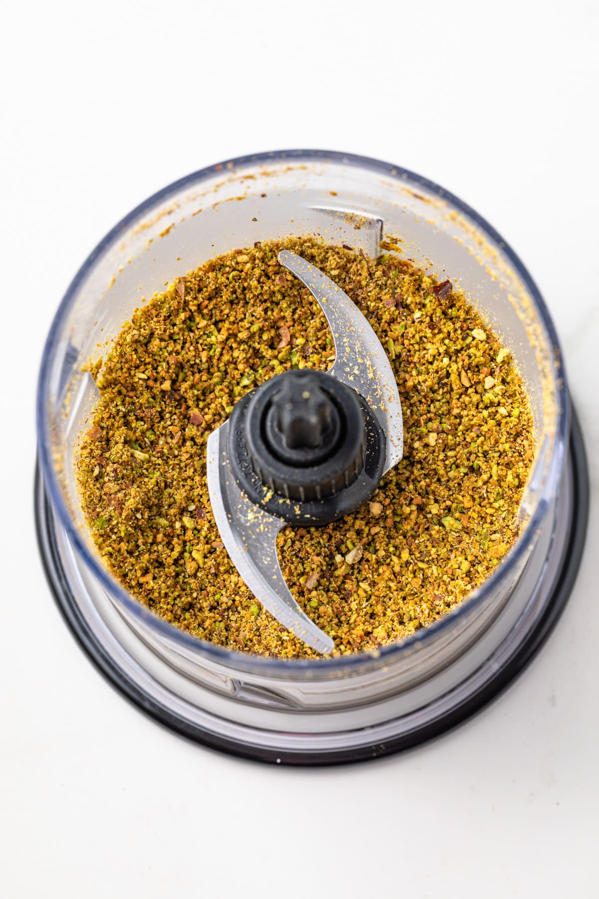Ground pistachios in a food processor.
