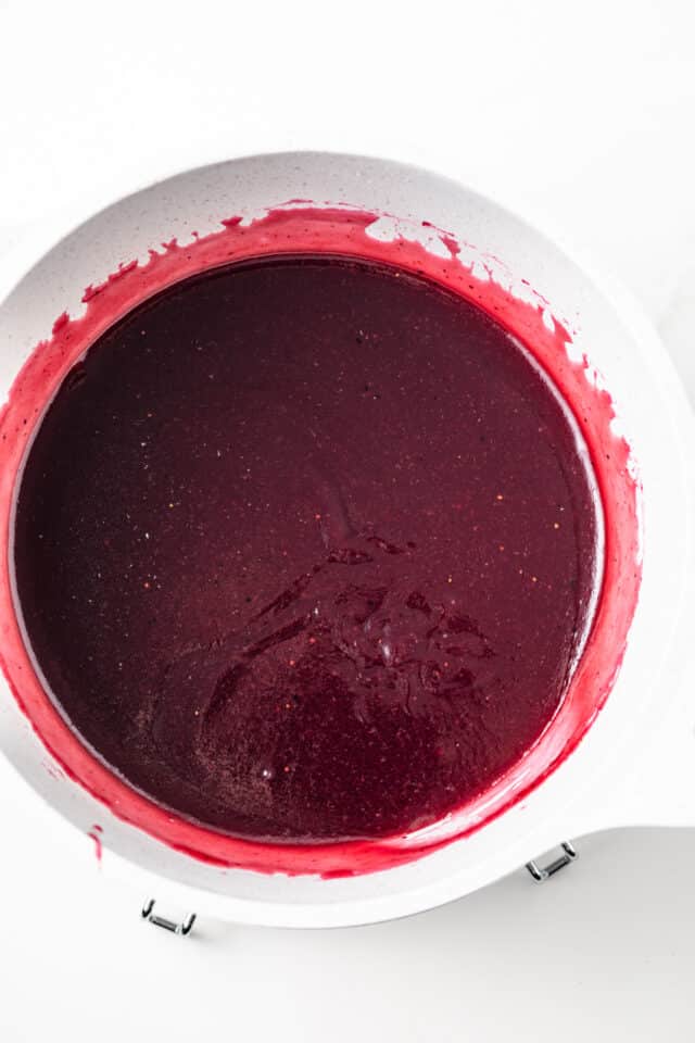 Mixed berry jam in a sauce pan.