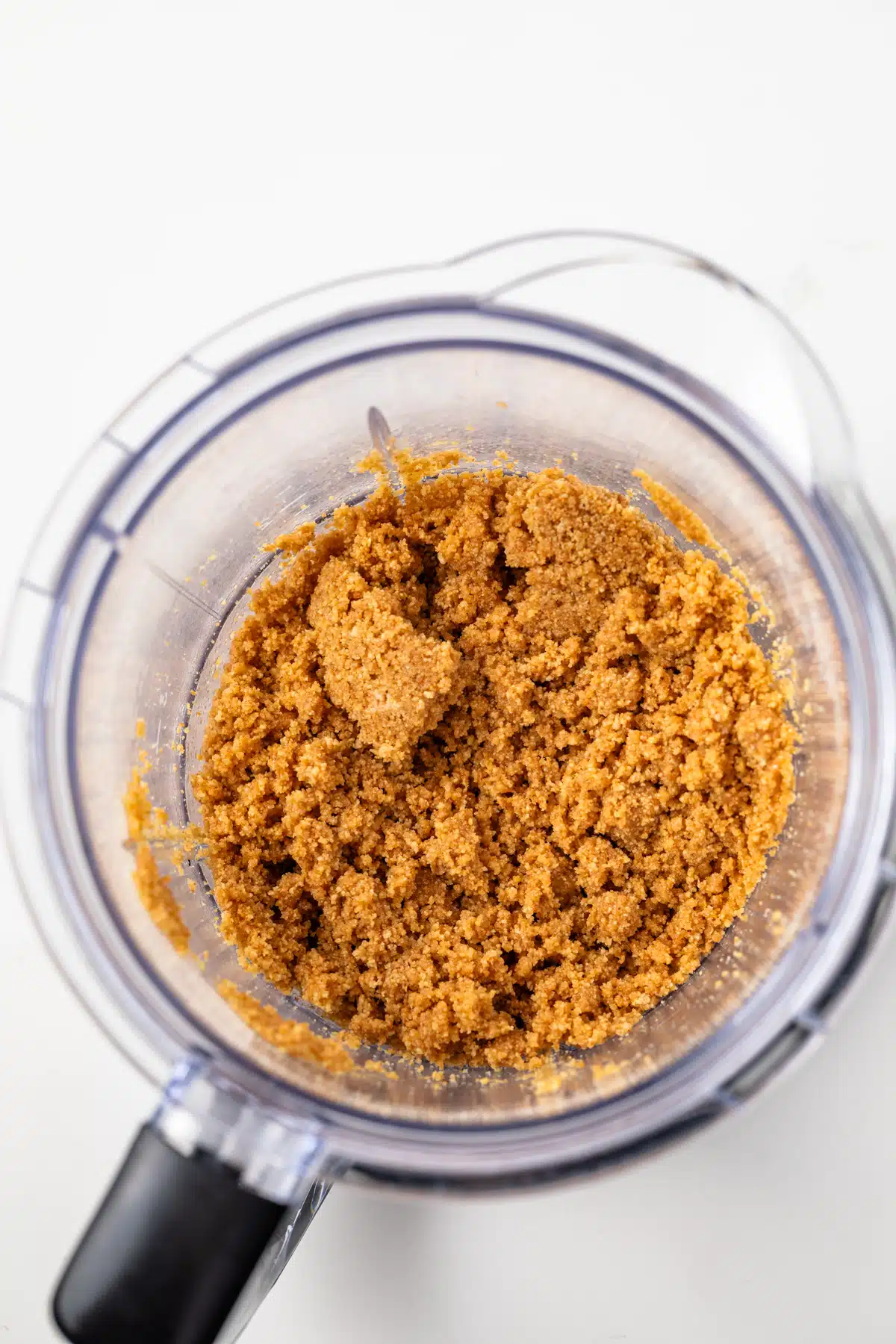Graham cracker crumbs in a food processor.