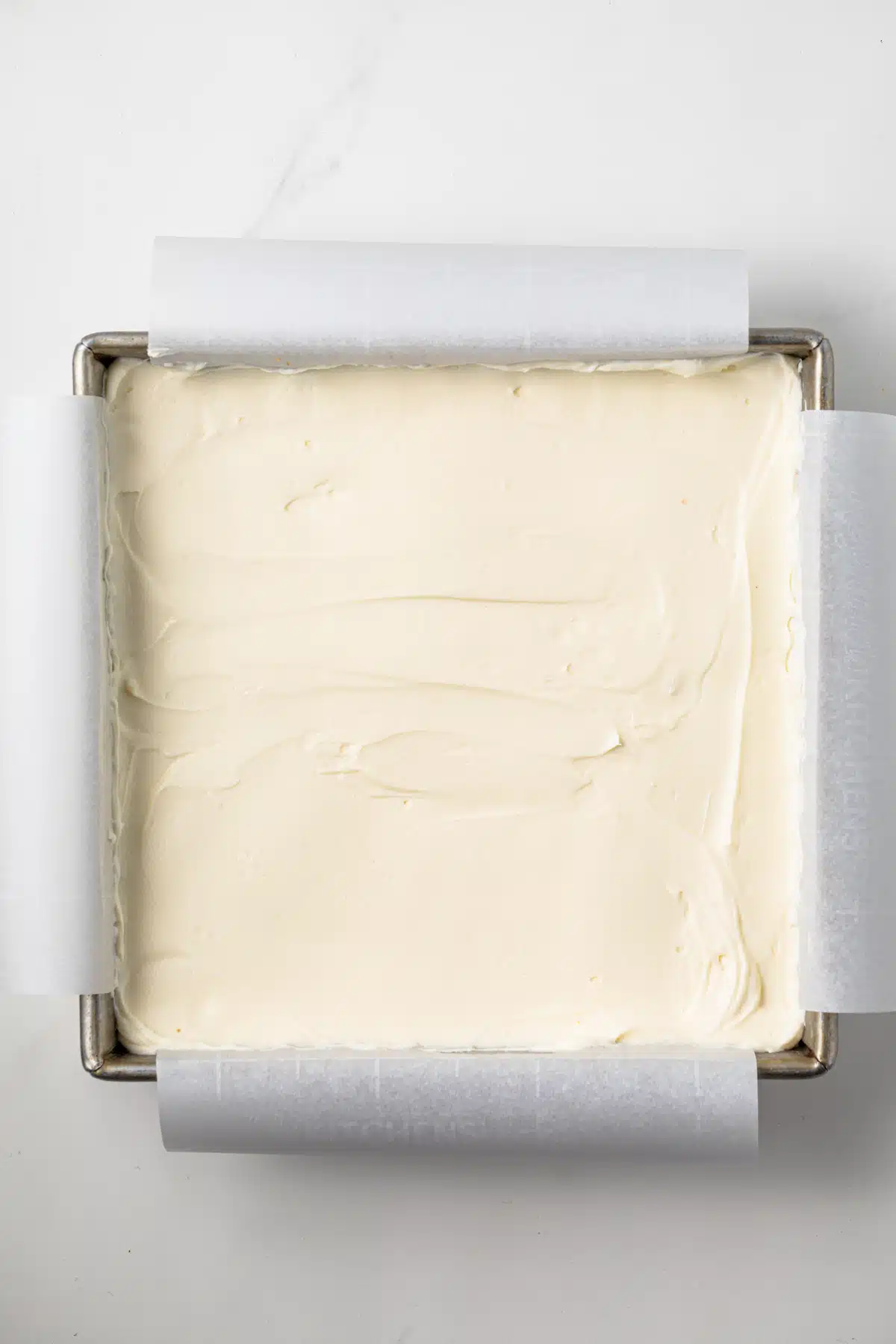 Cheesecake filling in a pan.