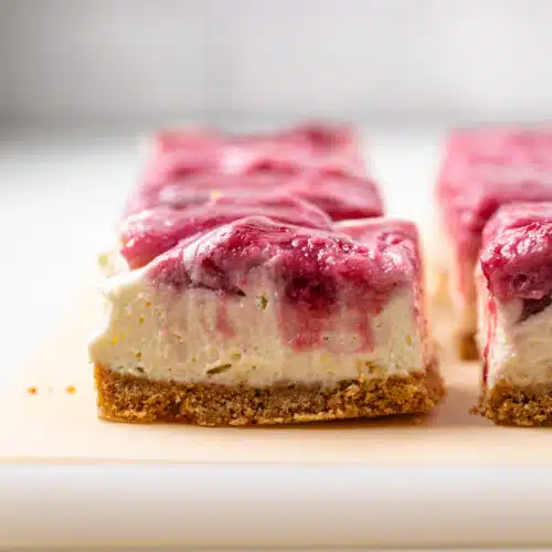 Side view of no bake berry cheesecake bar.