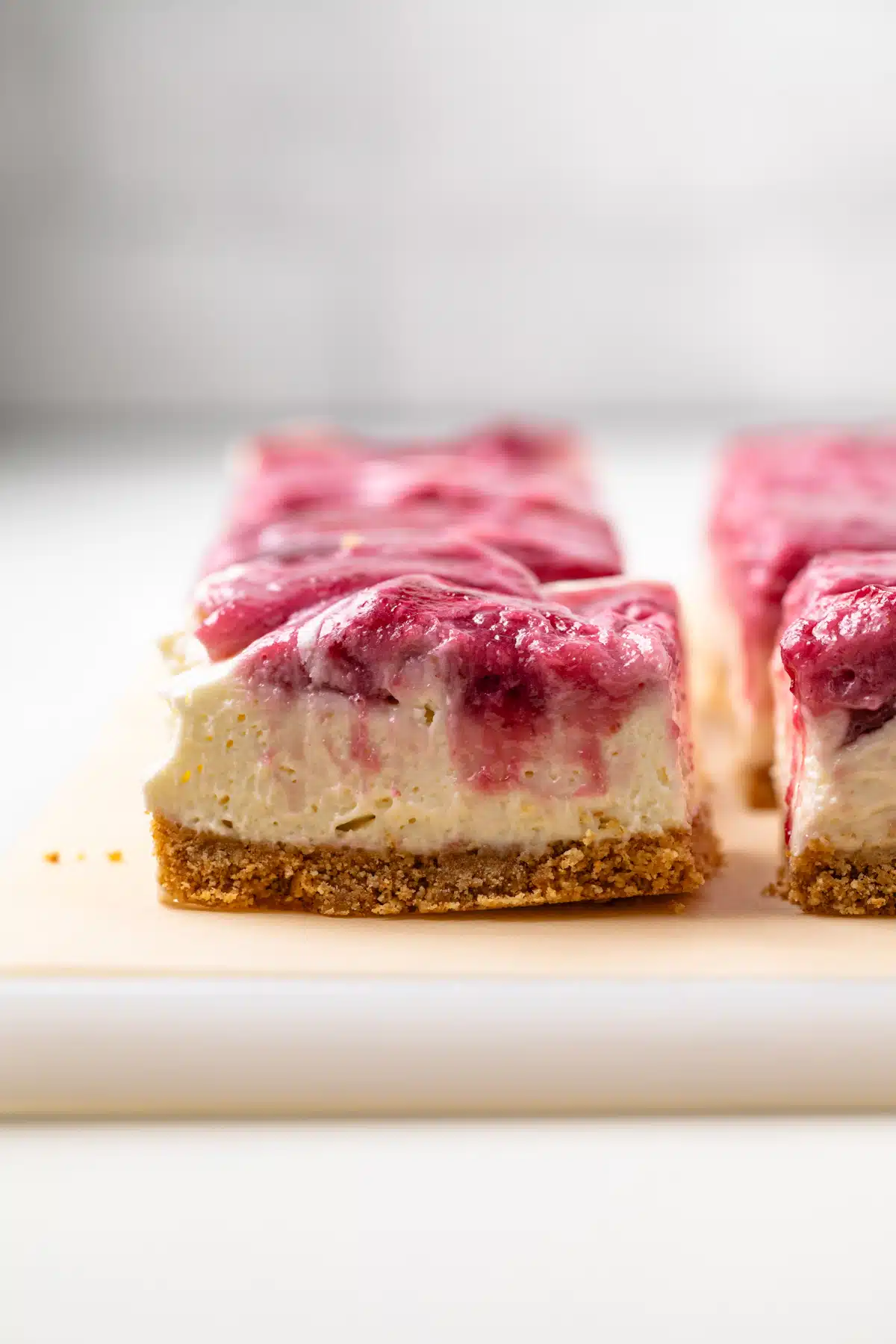 Side view of no bake berry cheesecake bar.
