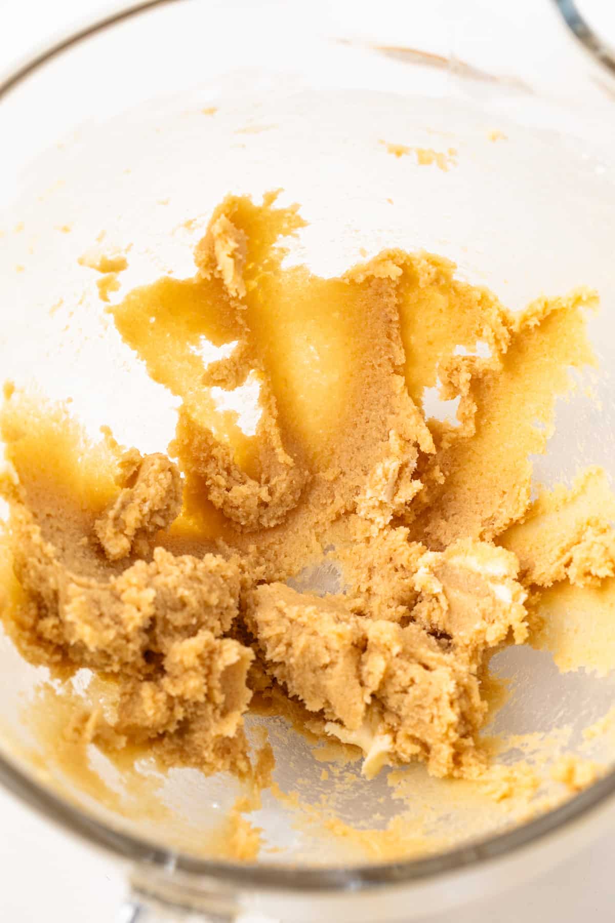 Creamed butter and sugar in a glass bowl.