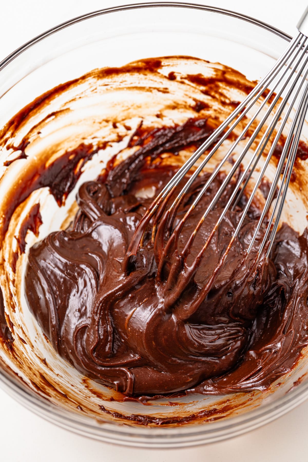 Cooled chocolate in a glass bowl.