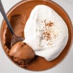 A spoon scooping out a bite of chocolate coffee mousse.