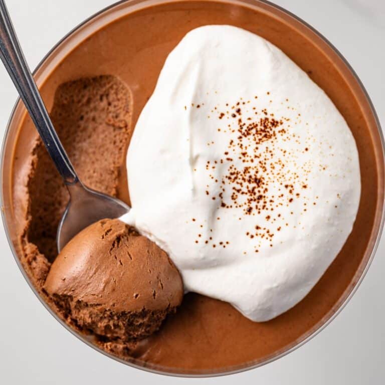 A spoon scooping out a bite of chocolate coffee mousse.