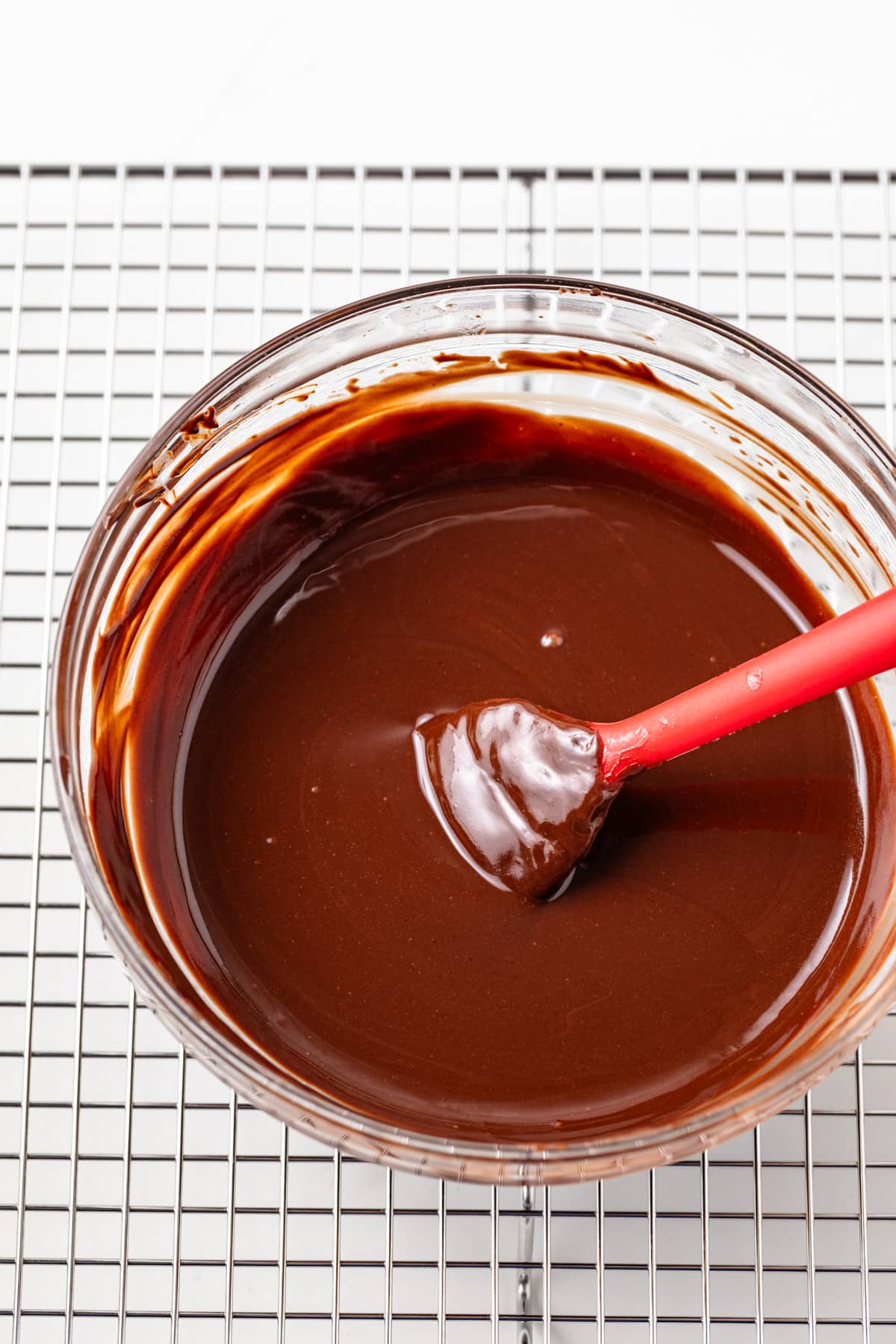 Melted chocolate in a glass bowl.