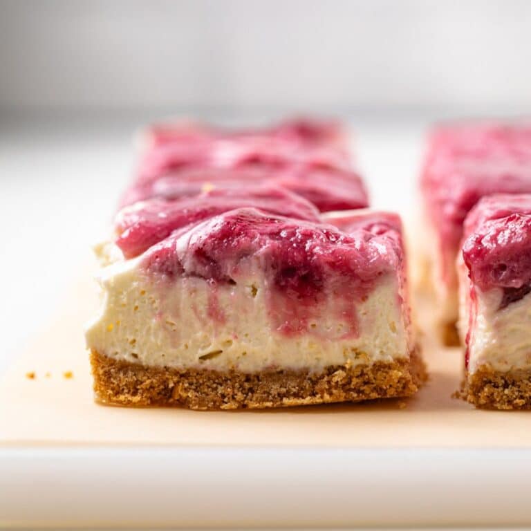 Side view of no bake berry cheesecake bar.
