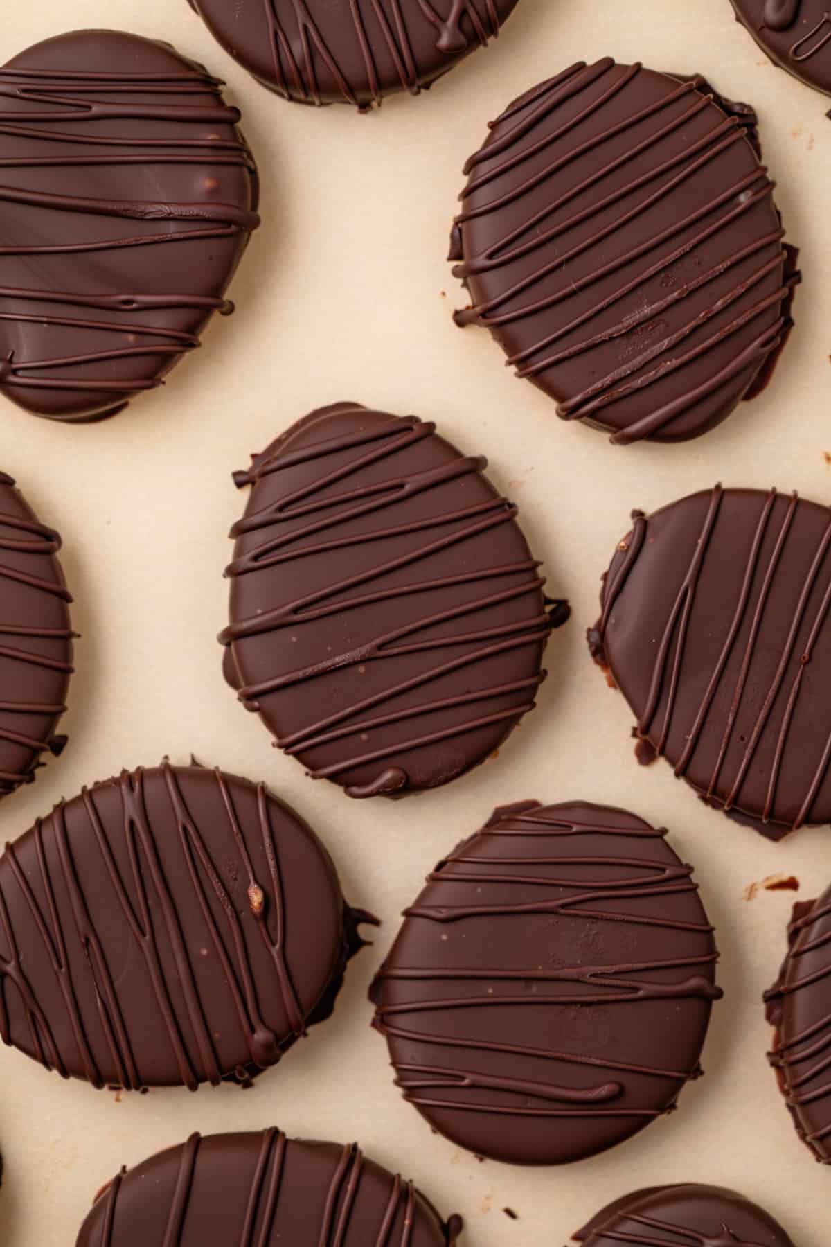 Overhead of peanut butter eggs on parchment paper.