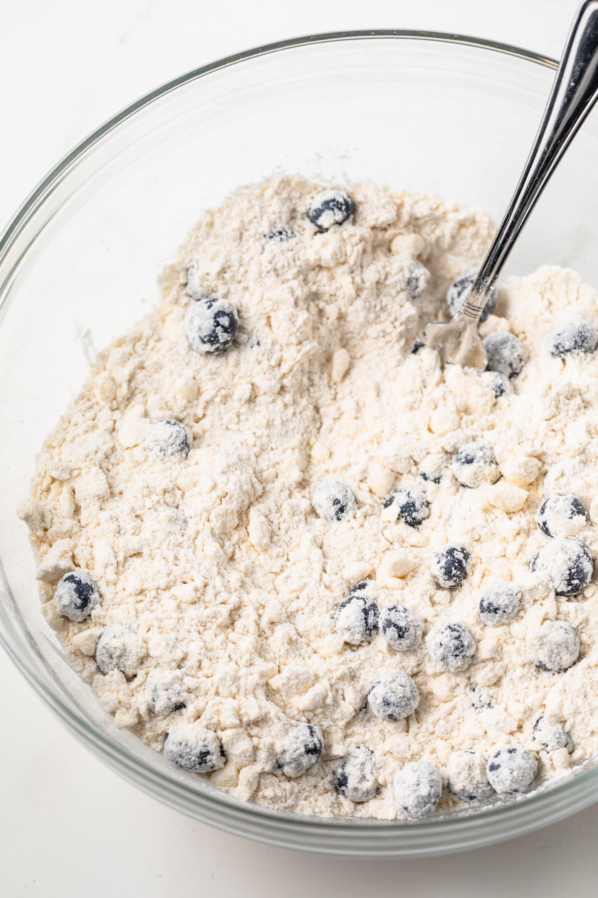 Dry ingredients for scones in a glass bowl.