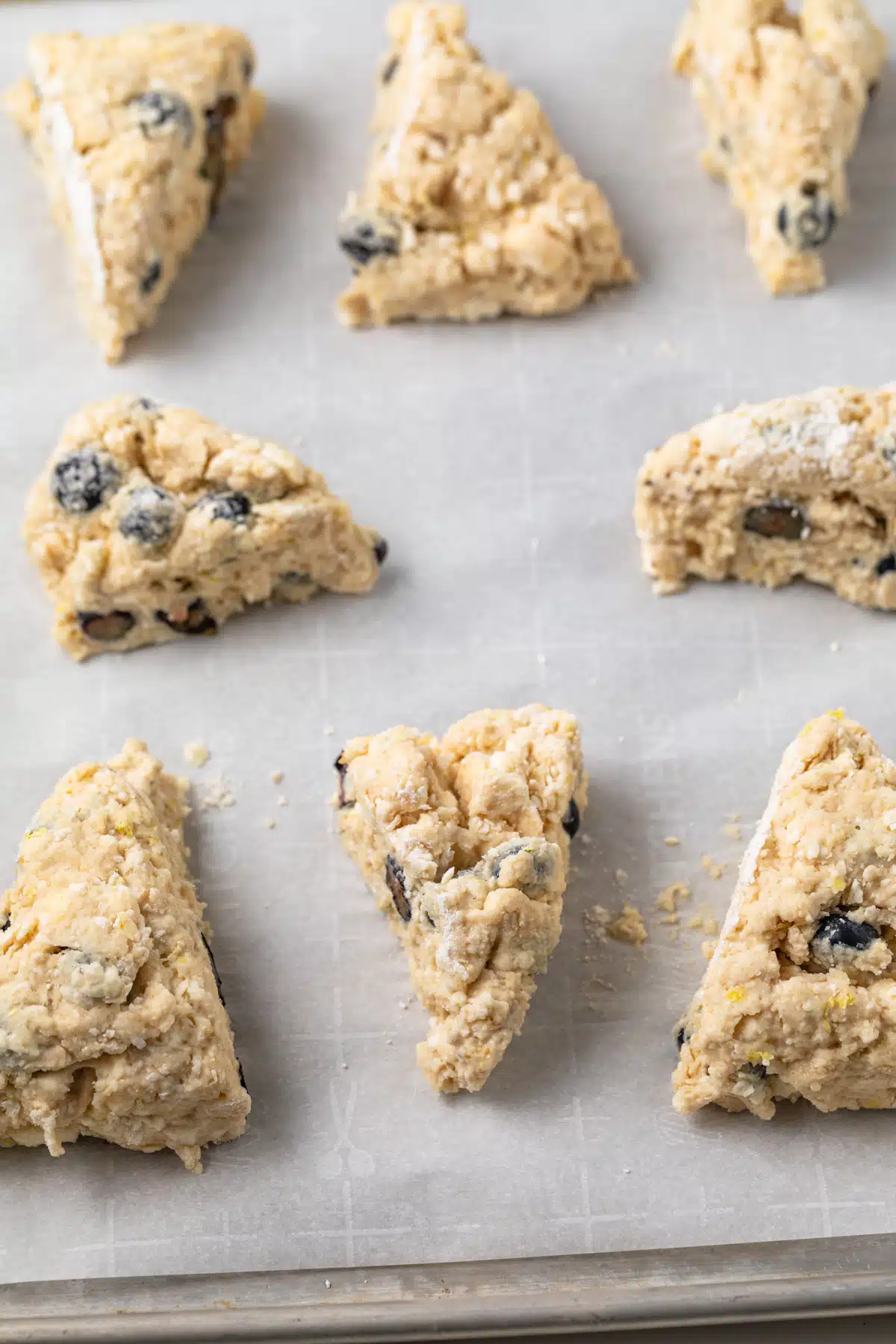Unbaked scones on a baking sheet.