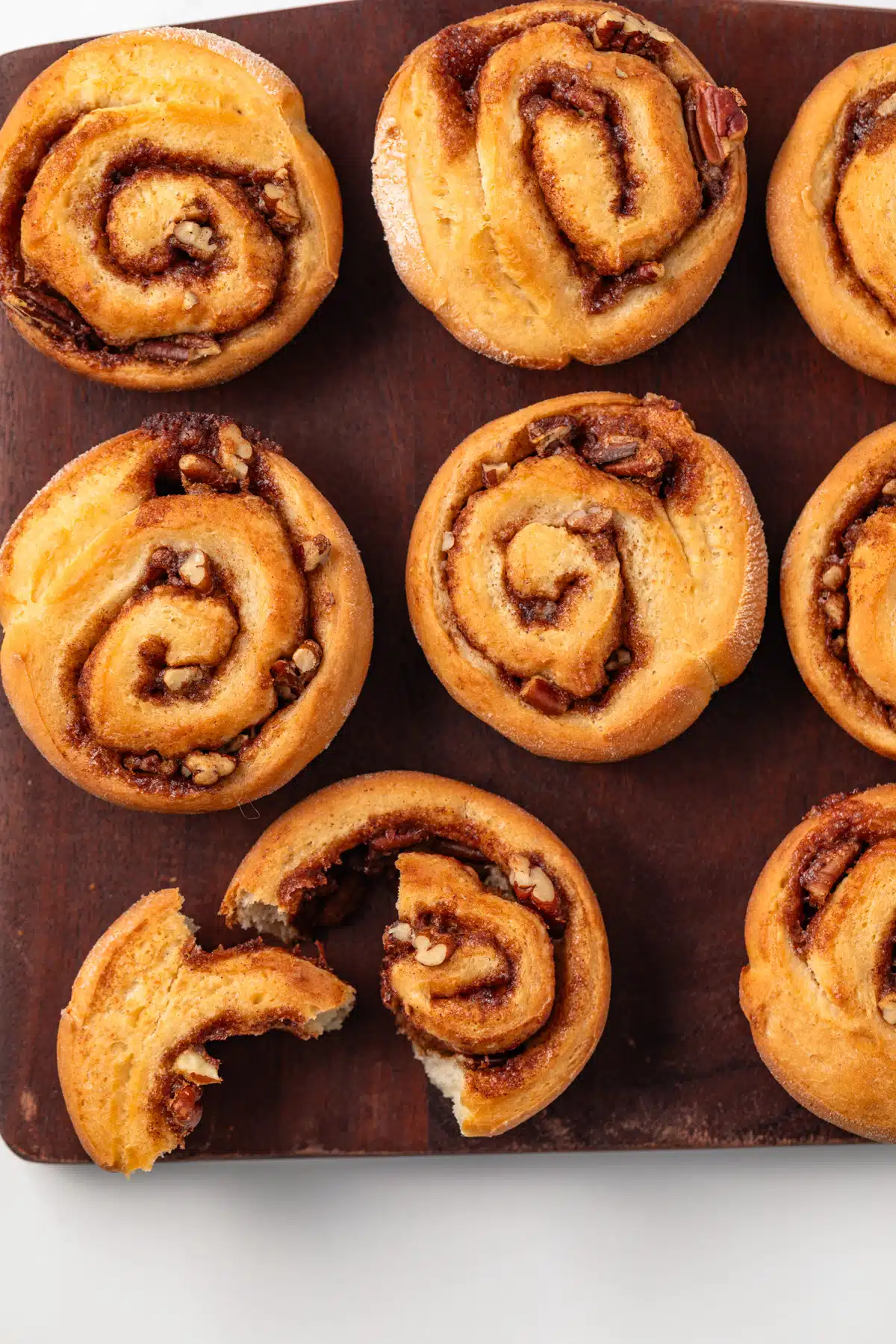 Pecan rolls on a wood board.