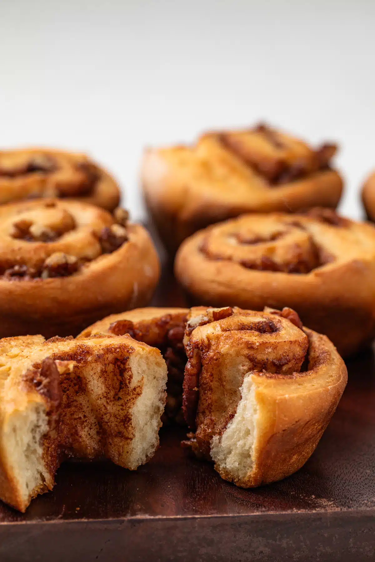 Pecan roll broken in half so the inside is visible.