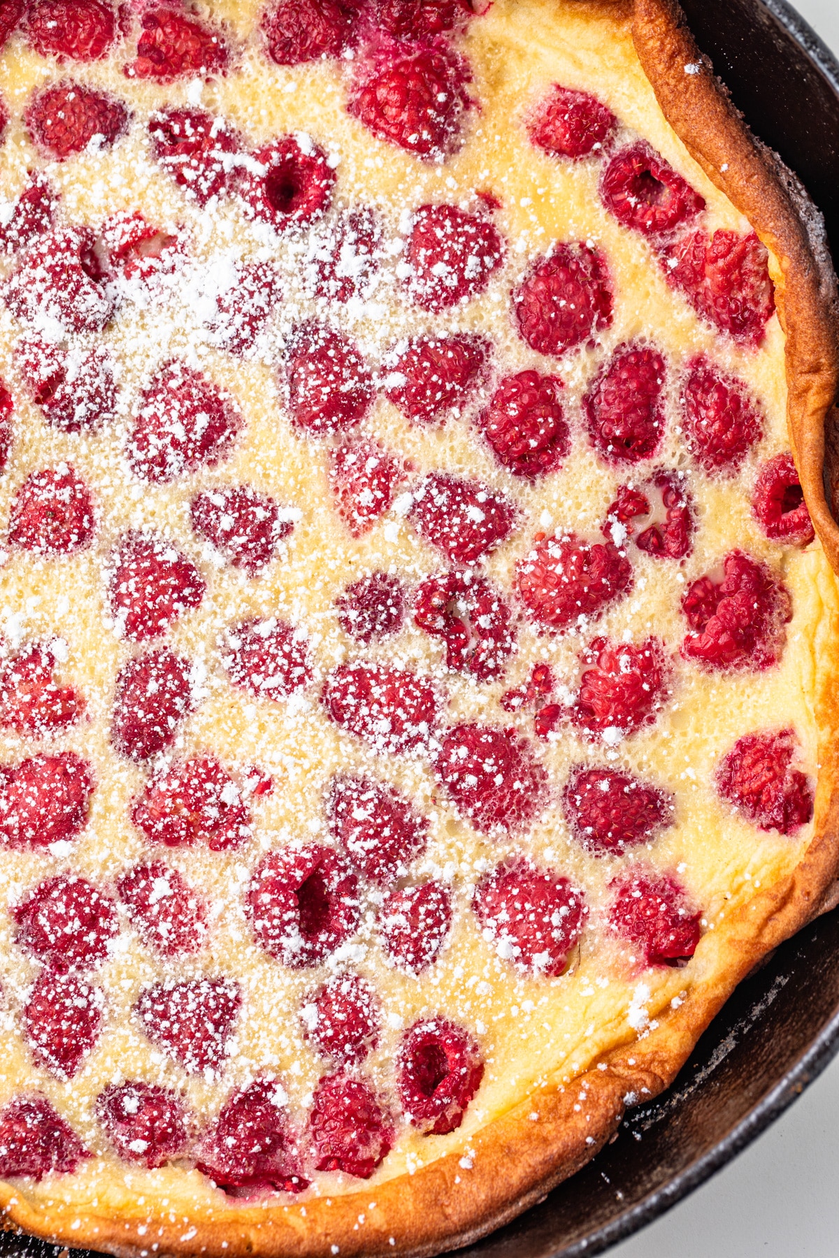 Close up of raspberry almond clafoutis.