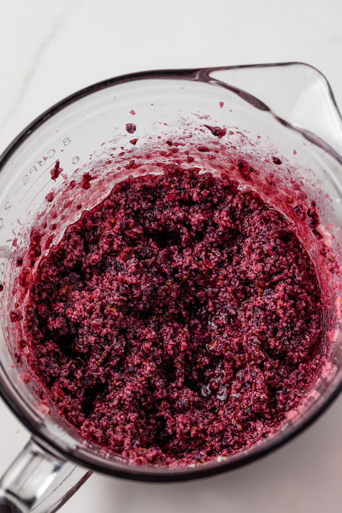Wet ingredients mixed in a glass bowl.
