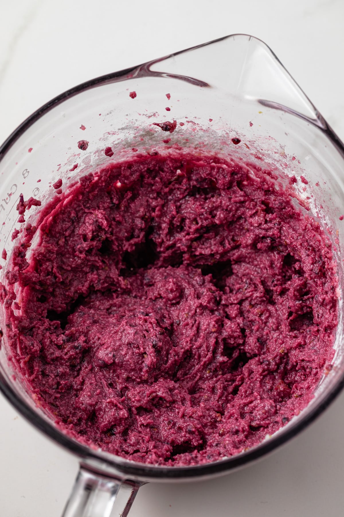 Blackberry lemon batter in a glass bowl.