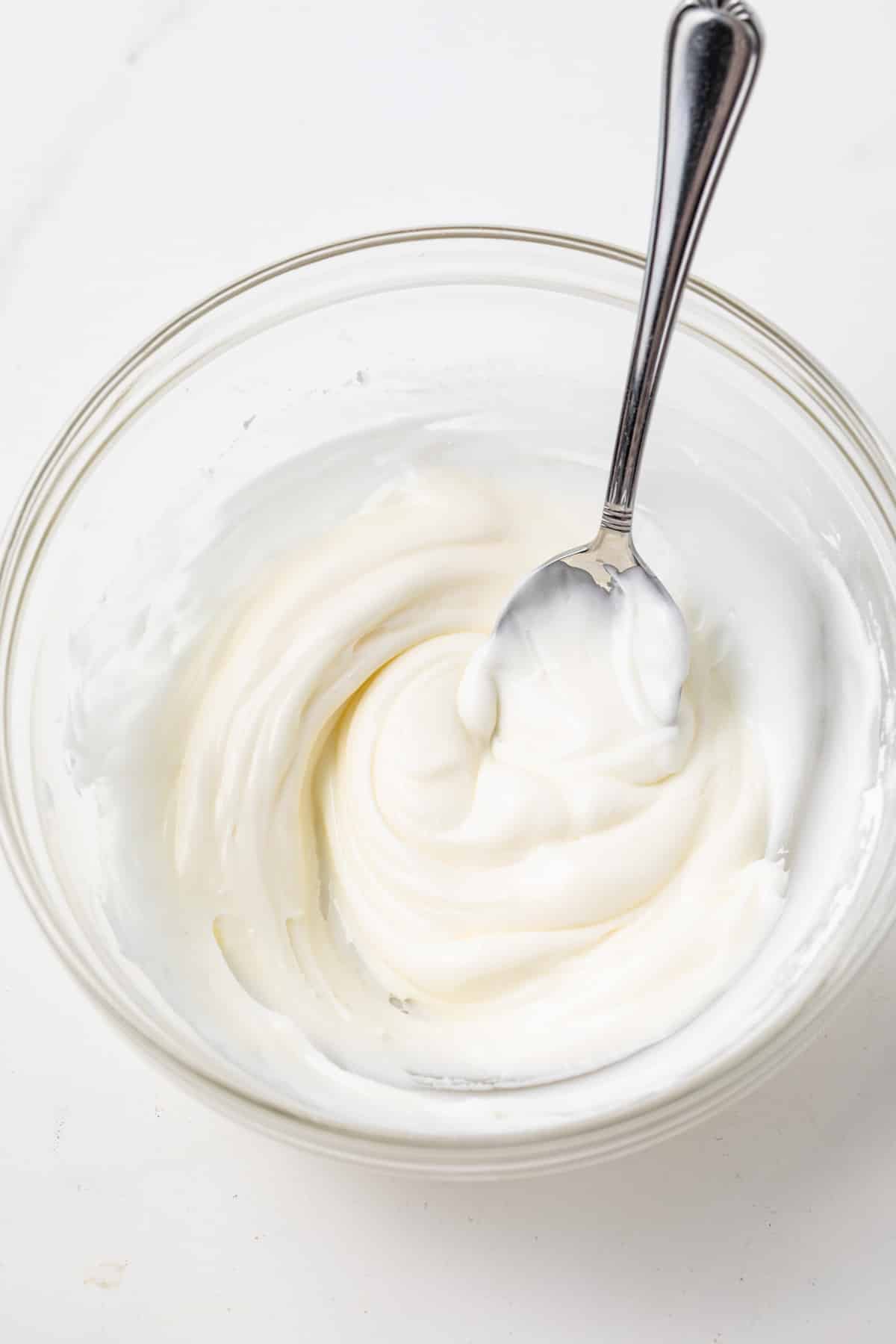 Lemon icing in a glass bowl.